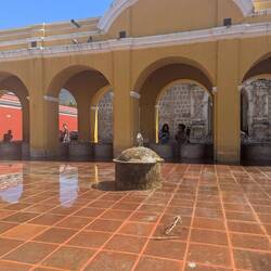 Fountain in park area. In rear are the ruins of the Santa Clara convent