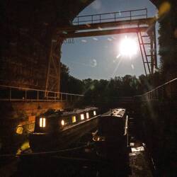 Rainboat and Enigma in the dry dock under a full moon