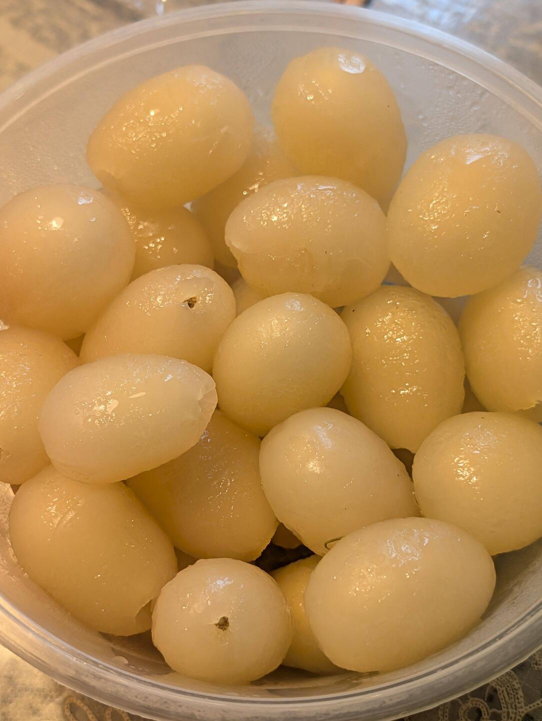 A bowl full of peeled rambutans. Asian love language.