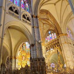 Gothic arches enclose a golden railing with massive GOLD altar behind that