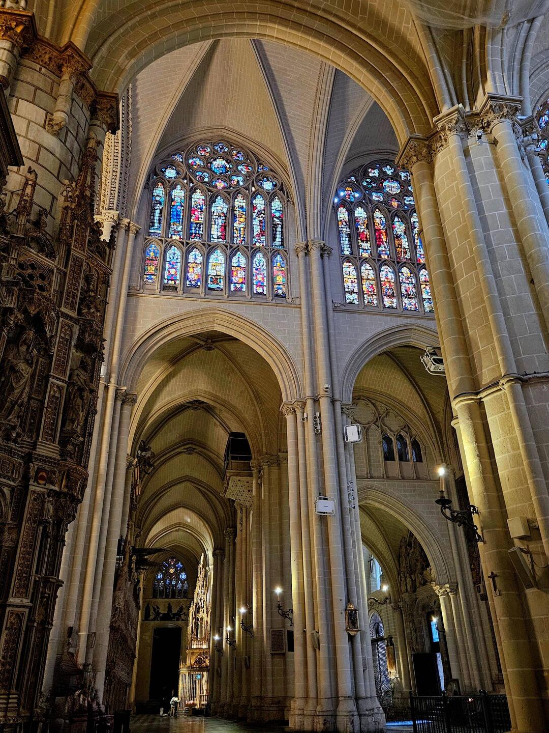 Gothic pillars and arches with stained glass