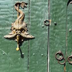 Ornate bronze door knockers once signaled family status and wealth in San Diego.
