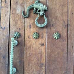 Ornate bronze door knockers once signaled family status and wealth in San Diego.