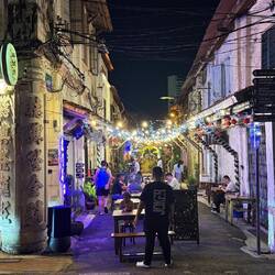 The streets, quiet by day, come alive at night