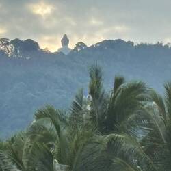 Buddha sits atop the nearby mountain.