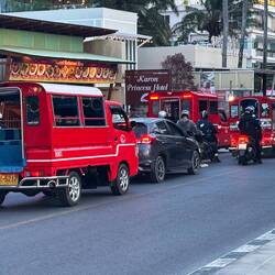 Hop in the back of a red taxi Tuk-Tuk, listen to the loud music and take a fun ride.