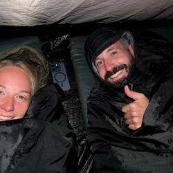 Cuddled up in our tent ⛺