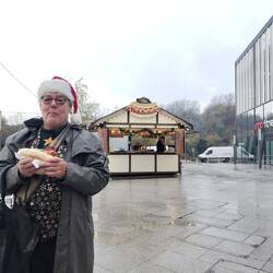 Bratwurst for lunch with his charity shop Christmas waistcoat