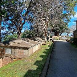 A cemetery surrounds the sides and rear of the church.