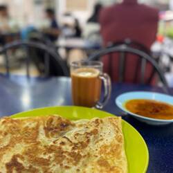 Breakfast roti canai (wrotey chaneye) and teh tarik - best of things to start the day (thanks Kate)!