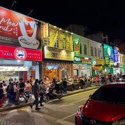 Jalan Sultan street, vibrant with restaurants and people out to eat.