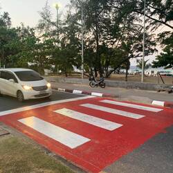 The Thai people are very polite, but do not ever, ever think that stepping into the crossing is safe