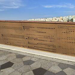 Quotes line the bridge walls in multiple languages