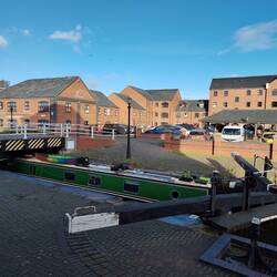 Moored under the closed swing bridge waiting for the council to open it