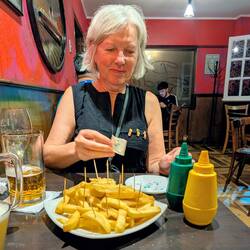 The girl's got class: beer and chips.