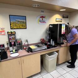 Rosanne getting her breakfast at the Super 8