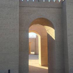 Behind it, the palace of Nebuchadnezzar.