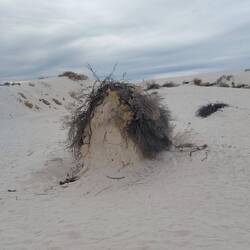 Der mit dem eigenen Sandhügel.