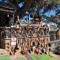 This homeowner has lots of shovels around their home.