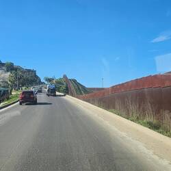 Crossing at Tijuana border crossing for 1st time. Very smooth crossing! That's US & wall on right