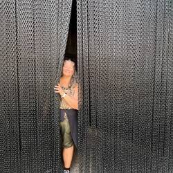Rosanne at the Humming Bird gate curtain. It's lightweight chain.