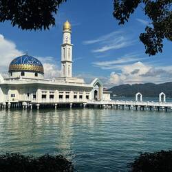 Floating mosque of Masjid Al-Badr hovering gracefully above the waters of Teluk Baru.