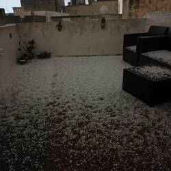 Hail on our rooftop deck. Photo taken at 3am