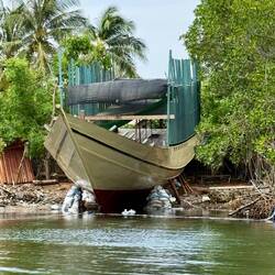 Her hull is completed so she's about to be pulled of the land, into the water to be completed