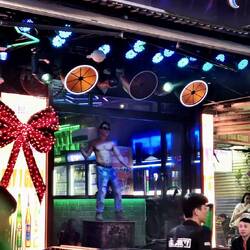 Equal opportunity exploitation : male go go dancer on Walking Street.