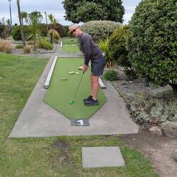 Rousing game of mini putt during a break in the weather.