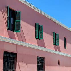 Traditional pink coloured colonial house.