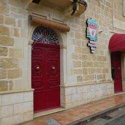 Found the Gozo chapter of the Liverpool Supporters Club, set up like an English pub inside.