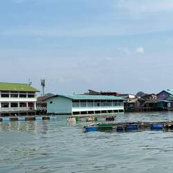 Panyee Island is a floating village, built on pilings, on the side of a cliff.