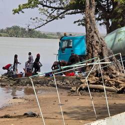 Washing day! While the concrete mixer washes, the clothes are also washed.