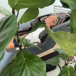 Doug relieving travel stress in massage chair