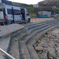 Daħlet Qorrot storm damage - the slab on the left was originally below the bottom step