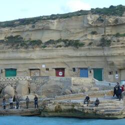 Daħlet Qorrot caves cut into the limestone cliff
