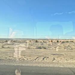 Crossing the desert on a bus, on the way to the capital.