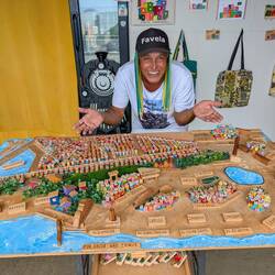 This is César, he's a fun guy! He runs a woodworking shop and built this model of the city by hand.