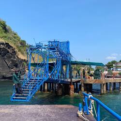 Just step up, grab the ladder, and you're off the gently- swaying pier. Gulp.