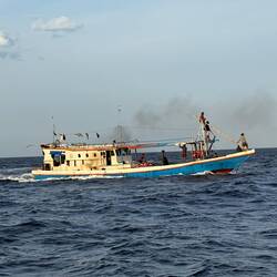 Safe harbour - Pantai Tengge - and one of the many fishing boats. She was circling, dropping nets