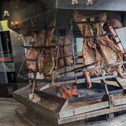 An asado with lamb on the spit