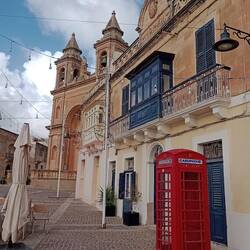 Malta encompassed - British influence, enclosed balconies, and so many churches