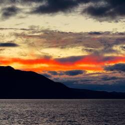 A colorful sunset before nightfall envelopes the scenery.