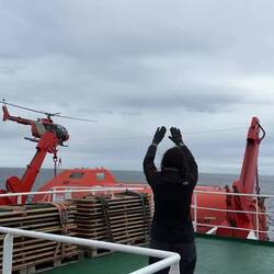 Bidding the helicopters adios as they leave Ortelius for the last time.