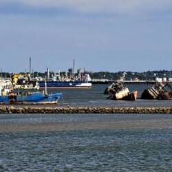 A bit of a boat graveyard in the harbor.