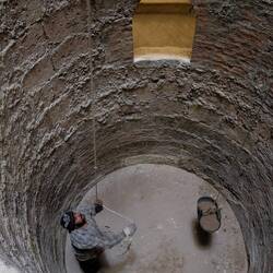 The "well" used to lower the caskets into the tomb. (Easier than carrying down the stairs)