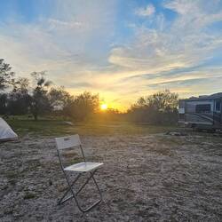 Joined by another traveler we met at gas station, we huddled around a fire playing harmonica & banjo