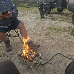 Tim warms us with his Howler propane stove. No...his foot is not on fire
