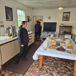 Mrs. Napier overlooking her exceptional baked good